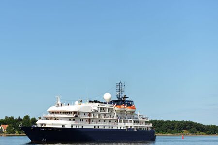 Big luxury cruise ship floating near shoreのeditorial素材