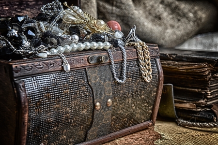 Wooden treasure chest with valuables. beads, necklaces and other jewelryの写真素材