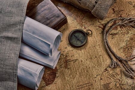 old compass on vintage map and  ropeの写真素材