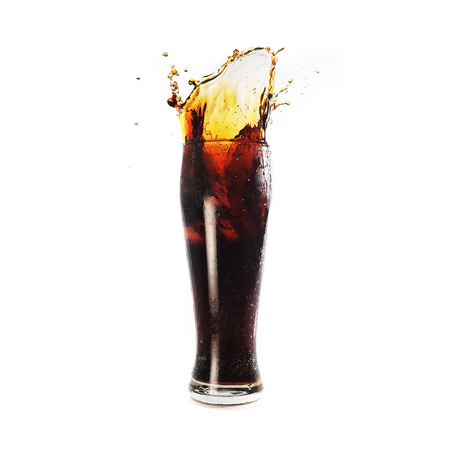 glass with cold drink costs on tableの写真素材