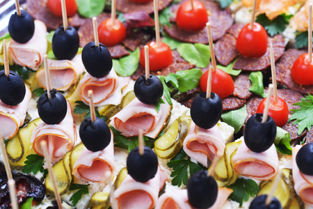 sandwiches with slices meat on wooden chopsticksの写真素材