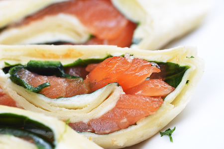 salmon in puff pastry on white dishの写真素材