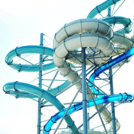 colourful aquapark pipes and blue skyの写真素材