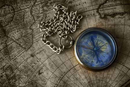 Vintage compass on old map 