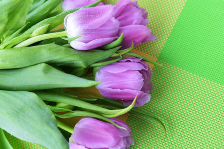bouquet of fresh pink tulips on  green napkinの写真素材