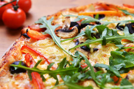  baked pizza with diferent ingredients