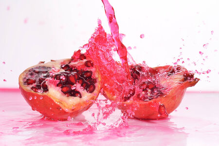 pieces of red ripe pomegranate  in juiceの写真素材