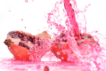 pieces of red ripe pomegranate  in juiceの写真素材