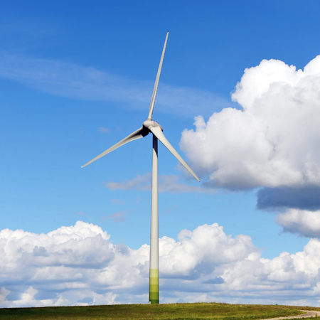 wind turbines in the fields under blue sky