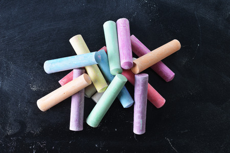 collection of colorful chalks on black background
