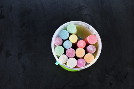 collection of colorful chalks on black backgroundの写真素材