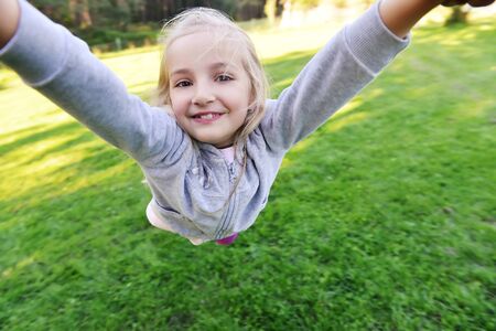 little girl playing in parkの写真素材