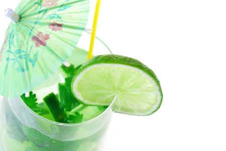 cocktail into glass and cubes of iceの写真素材