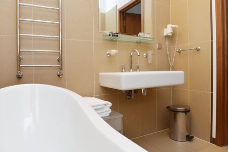 bathroom with terracotta tiles and  bathtubの写真素材