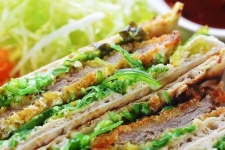 sandwiches with meat and vegetables on  plateの写真素材
