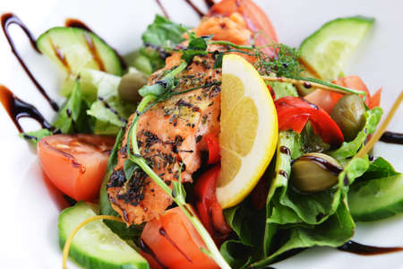 salad of vegetables and meat on dishの写真素材