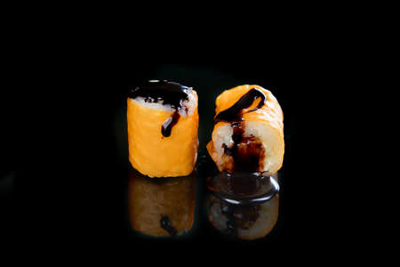 Delicious sushi rolls  on black backgroundの写真素材