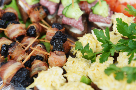 fish and meat snack with vegetables on  chopsticksの写真素材