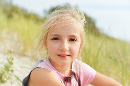 Portrait of lovely blond little girlの写真素材