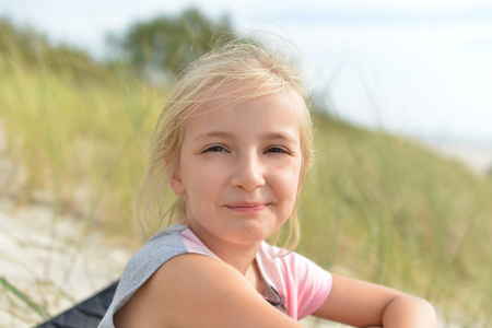 Portrait of lovely blond little girlの写真素材
