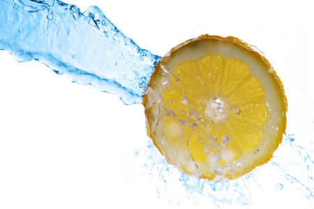 slice of lemon in  water with bubblesの写真素材