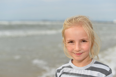 Little girl  playing on  sea beachの写真素材