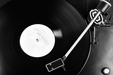 Vinyl record spinning on turntable close upの写真素材