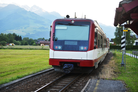 electric train rides on railroad