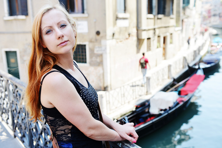 young woman amongst  historic houses and canals in Veniceyoung woman amongst  historic houses and canals in Veniceの写真素材
