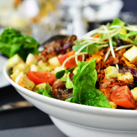 Fresh and tasty salad on plateの写真素材