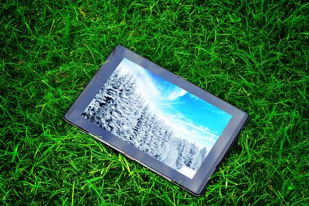 generic tablet computer (tablet pc)  on green grass