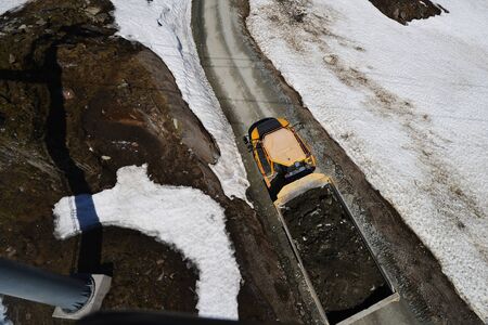 Truck loaded with rides on mountain road