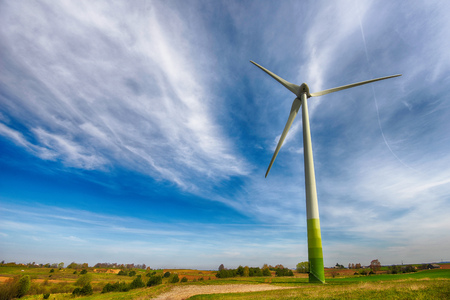 wind turbines in  fields under blue skyの写真素材