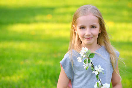 girl on green lawn. warm summer day