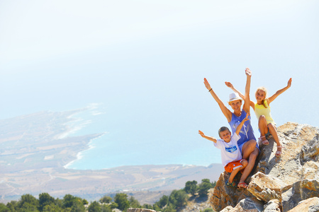 woman with her children on top of mountainの写真素材