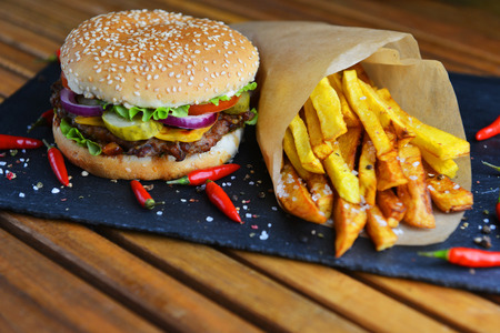 Tasty and appetizing hamburger with friesの写真素材