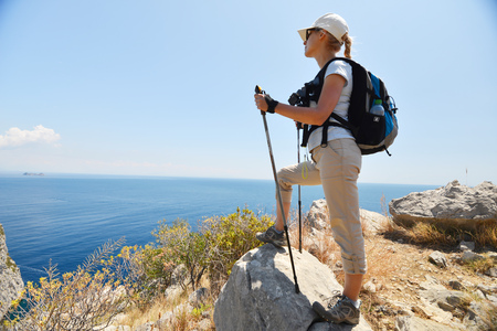 Woman stand at top of mountainの写真素材