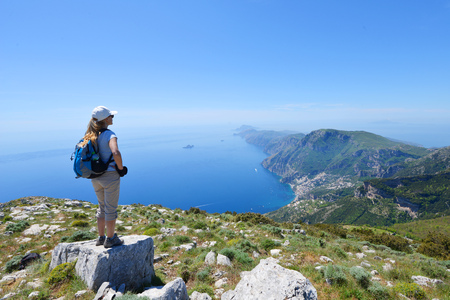 Woman stand at top of mountainの写真素材