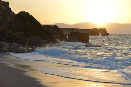 waves splash at stones on shore seaの写真素材