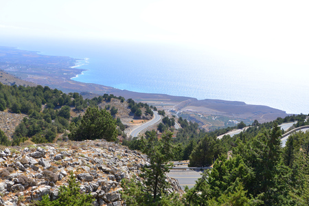 road winds among mountains to seaの写真素材
