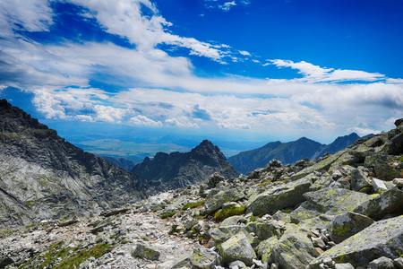 slopes and peaks of mountains and blue sky landscapeの写真素材