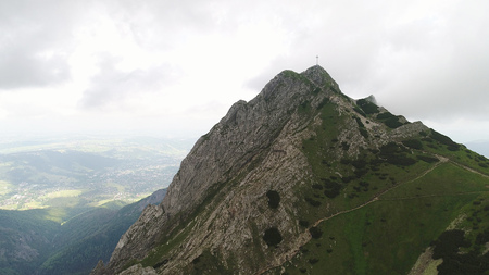 slopes and peaks of mountains and blue sky landscapeの写真素材