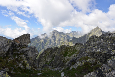 slopes and peaks of mountains and blue sky landscapeの写真素材