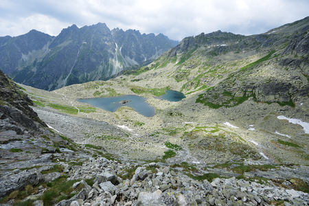 slopes and peaks of mountains and blue sky landscapeの写真素材