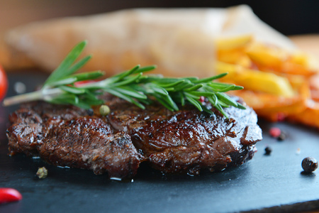 french fries and steak on plateの写真素材