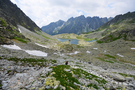 slopes and peaks of mountains and blue sky landscapeの写真素材