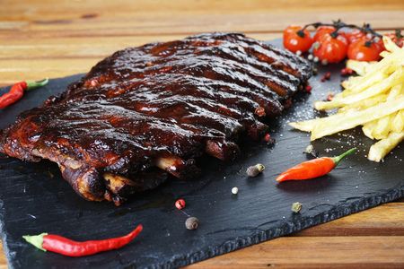 fried potatoes and pork ribs on aplateの写真素材