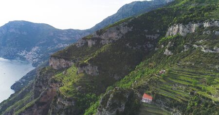 slopes mountains and sea under blue seaの写真素材