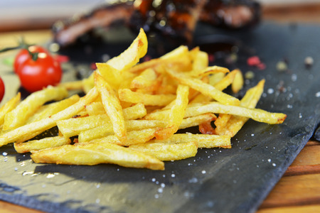 fried potatoes and pork ribs  plateの写真素材