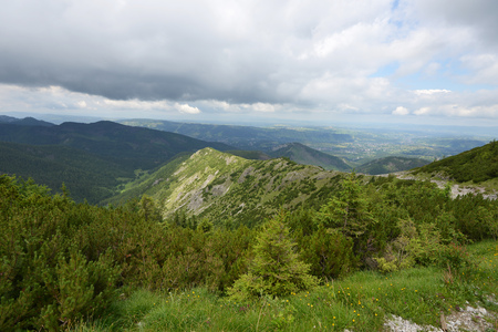 slopes and peaks of mountains and blue sky landscapeの写真素材